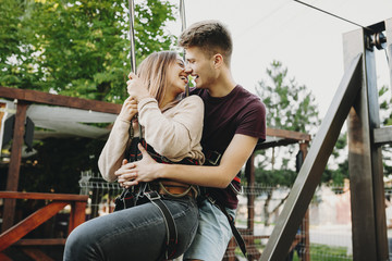 Loving couple preparing for zip line ride