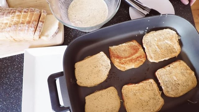 Time lapse. Step by step. Preparing French toast for breakfast on electric griddle