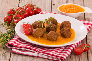 Meatballs with carrot purée.
