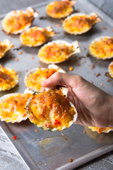 oven baked scallop with cheese, bell pepper and herbs