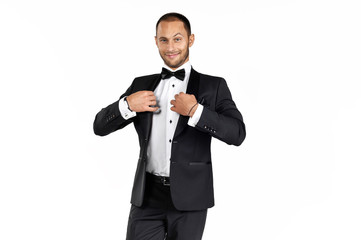 
Serious man in a tuxedo on a white background.
Isolated picture of the agent.