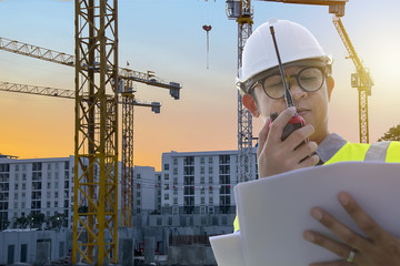 Engineers are in control Using radio  communication tools and see the blueprints.