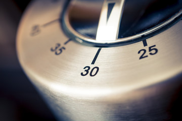 30 Minutes - Macro Of An Analog Chrome Kitchen Timer With Dark Background