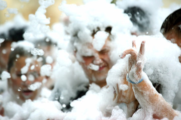 man in a soapy foam at the festival disco