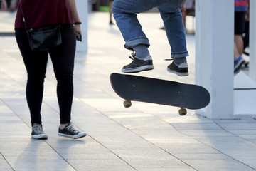 jump a young man on a skateboard