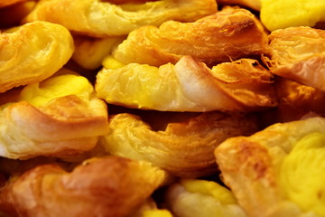 A seamless background of mouth-watering pastry rolls. Close-up