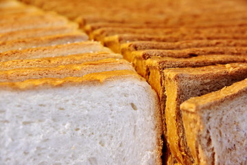 Solid background of sliced bread. Close-up
