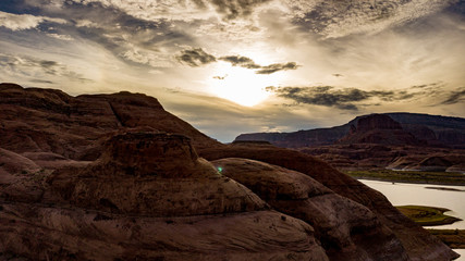 Aerial view of Lake Powell near Navjo Mountain, San Juan River in Glen Canyon with colorful buttes, skies and water