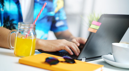 Working From Home. Close up Man Working on Laptop at Summer Holiday