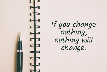 Inspirational and motivation life quote on note pad - If you change nothing, nothing will change....