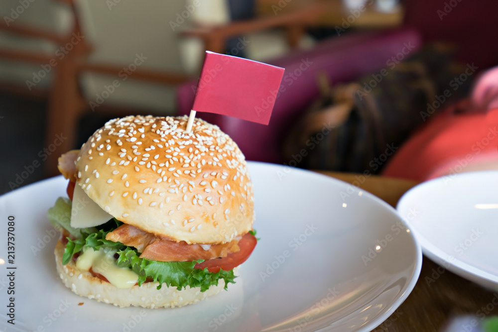 Wall mural hamburger places in a white ceramic dish at restaurant