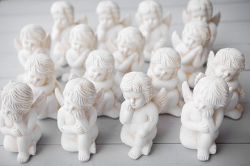 A little miniature statues angels with wings and halo.