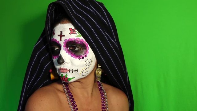 Mexican Day of the Dead sugar skull face painting close up calavera green screen