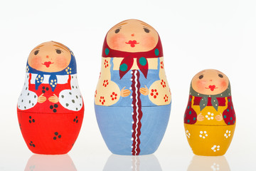 Fototapeta premium Three Russian dolls babushka matryoshka isolated on white background