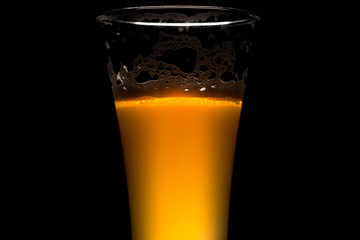 IPA craft beer glass on black background