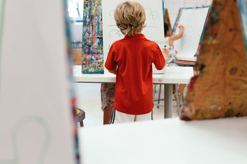 boy working on art project