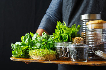 Healthy food source protein vegetarians vegetable greens groats seeds hands man