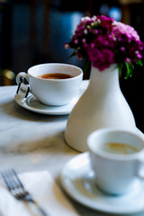 Table setting with coffee and flowers