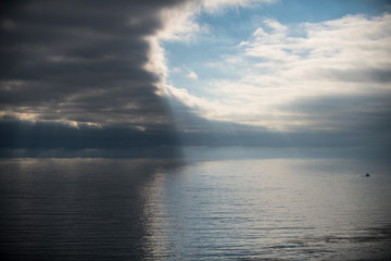 Sun Rays Through Coastal Clouds