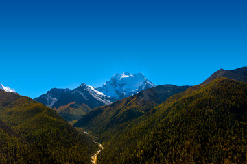 Beautiful mountain view with blue sky at Yading national reserve at Daocheng County, in the southwest of Sichuan Province, China.