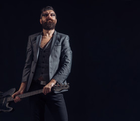 Guitarist or guitar player. Guitarist hold guitar. Guitarist with electric guitar. Rock music guitarist, copy space