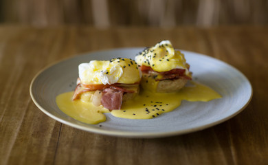 Eggs Benedict- toasted English muffins, ham, poached eggs, and delicious buttery hollandaise sauce