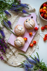 Tasty cupcakes on a white table. Cupcakes with sweet berries.