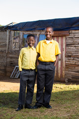 Two black boys looking into the camera