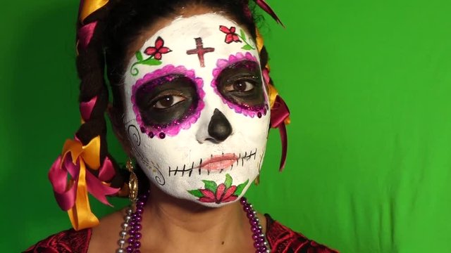 Mexican Day of the Dead sugar skull face painting close up calavera green screen