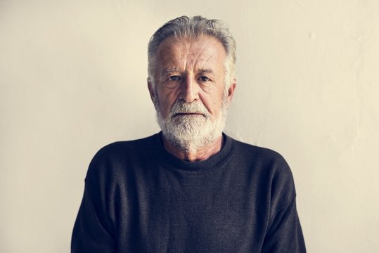 Protrait of elderly caucasian man with thoughtful face expression