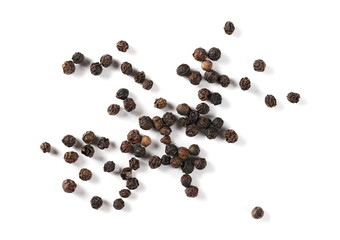 Black pepper pile, peppercorn isolated on white background, top view