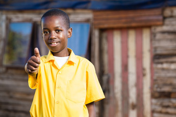 Black boy showing a thumbs up