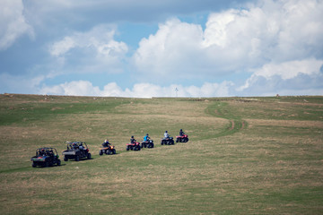 Obraz premium man riding atv vehicle on off road track ,people outdoor sport activitiies theme