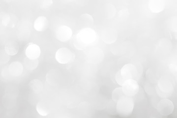 Brilliant background for the New Year holiday. Balls with a blurry pattern of gray and white.