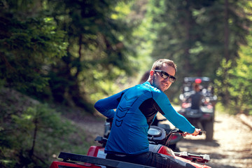 man riding atv vehicle on off road track ,people outdoor sport activitiies theme © FS-Stock