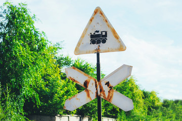 Old rusty road sign, beware of the train.
