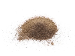 Ground black pepper powder pile, peppercorn isolated on white background