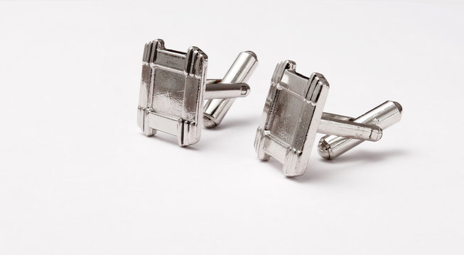 Silver Cufflinks On Grey Background