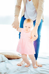 Make effort. Serious kid pressing lips while looking aside