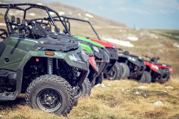 parked in a row several atv quad bikes extreme outdoor adventure concept