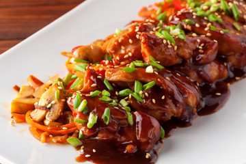 Teriyaki chicken grill with sliced vegetables