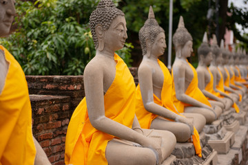 Row of buddha in Wat Yai Chaimongkhol in Ayutthaya Thailand.