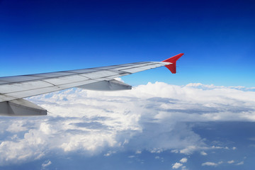 Airplane wing with blue clear sky