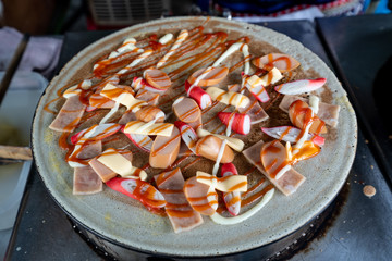 Crepe with sausage and sauce