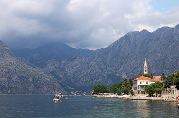 Fototapeta na wymiar Kotor bay sea and mountains with clouds landscape
