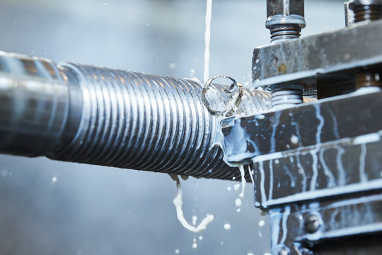 Thread cutting tool at metal working lathe machine