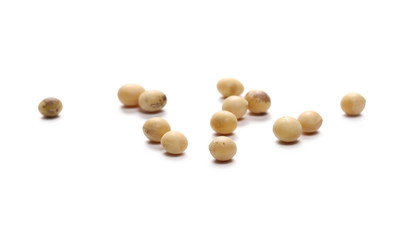 Organic raw soybean flakes, isolated on white background
