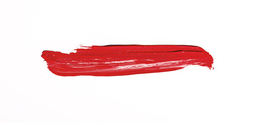 Red brush stroke isolated over white background