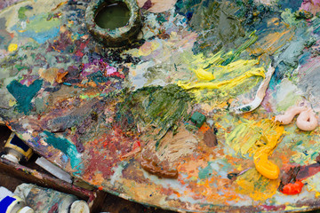 Close up palette with oil paints.