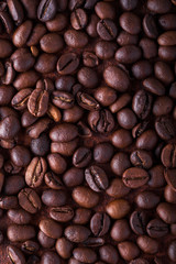 Photo closeup of coffee beans. Rusty background. Copy space.